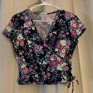 Medium dark purple with pink and yellow flower crop top! Like new.